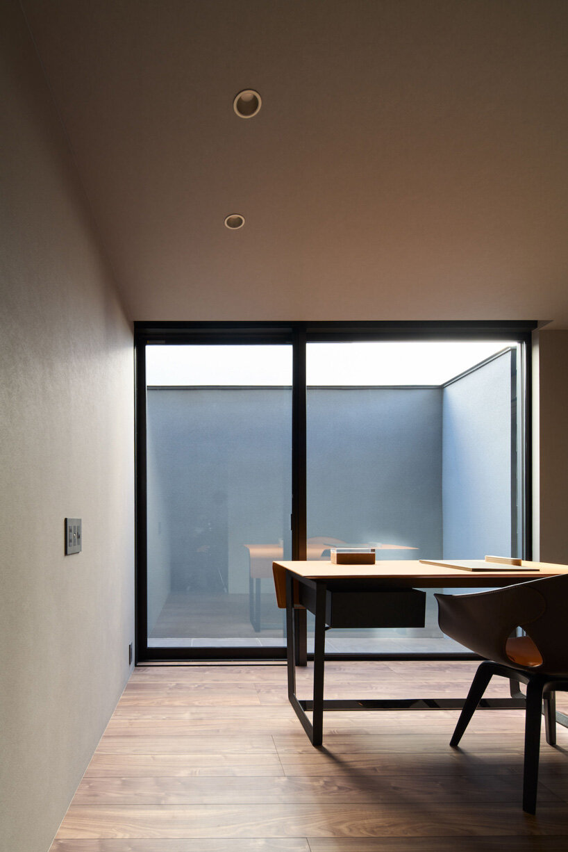 glassed-in balcony fronts apollo architects' timber 'grace' house in tokyo