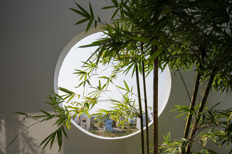 round openings + blank spaces form AD9 architects' vietnamese house
