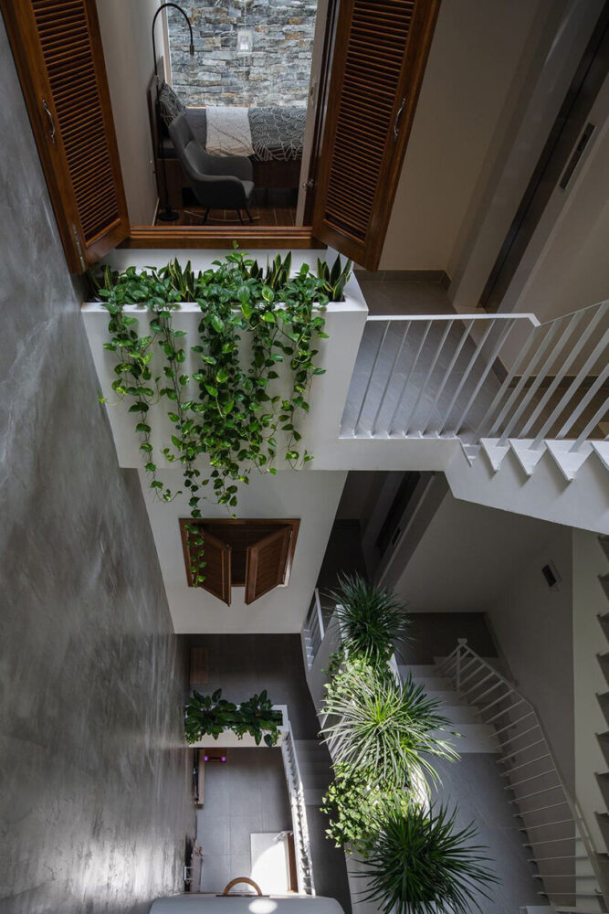 round openings + blank spaces form AD9 architects' vietnamese house