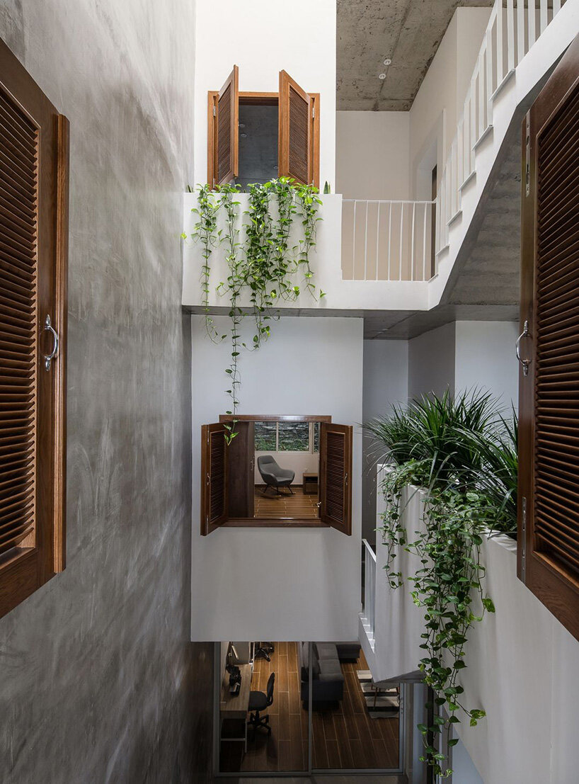 arches, round openings + blank spaces form AD9 architects' vietnamese house