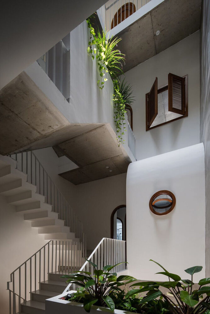 round openings + blank spaces form AD9 architects' vietnamese house