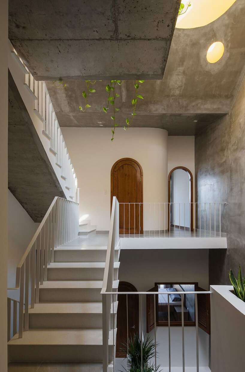 arches, round openings + blank spaces form AD9 architects' vietnamese house