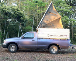 truck glamping unit by banana drive spreads open from a single wooden box
