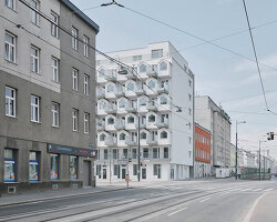 pitched roof volumes animate a vienna apartment block designed by BFA x KLK