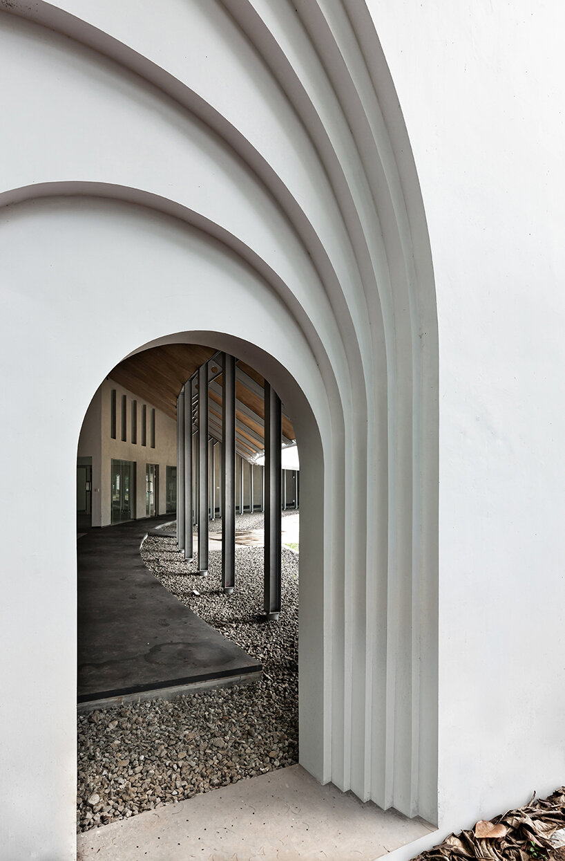 local architecture bureau's bogor creative hub stands as a sweeping, gestural curve