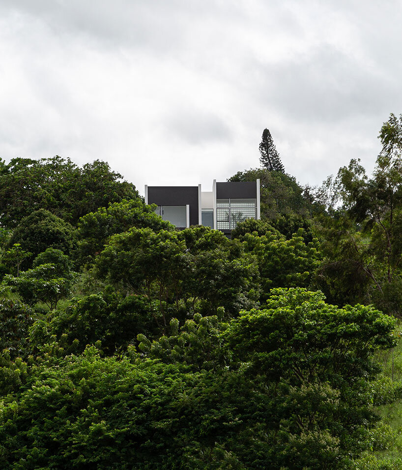 NEBR arquitetura's monolith carpina house rises from brazil's green lands