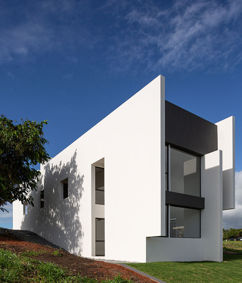 NEBR arquitetura's monolith carpina house rises from brazil's green lands