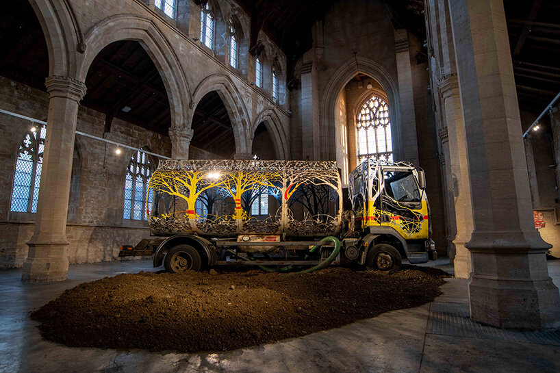 dan rawlings carves a steel forest into a reclaimed oil truck