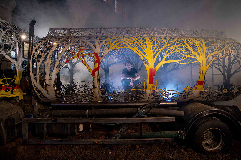 dan rawlings carves a steel forest into a reclaimed oil truck