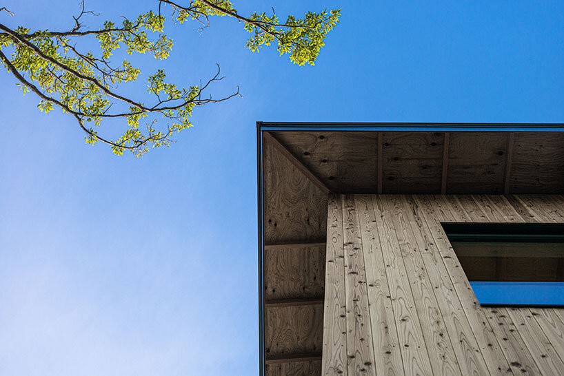florian busch architects wraps its I house in japan with a minimalist timber skin