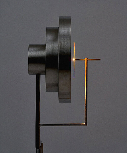 giwa eclipse is an elegant steel floor lamp inspired by a solar eclipse