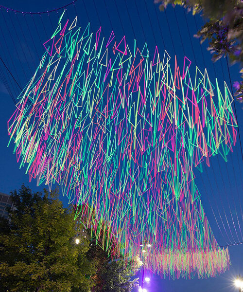 hou de sousa suspends 1,000 neon triangles over beacon park in detroit