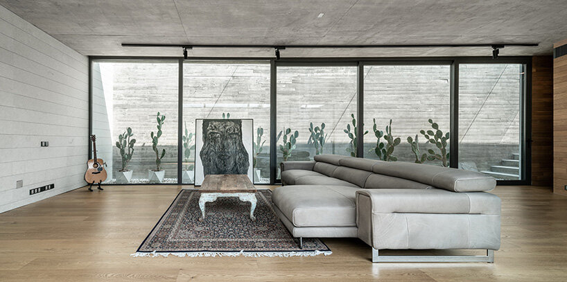 intersecting concrete slabs outline Stu/D/O architects' monolithic residence in thailand