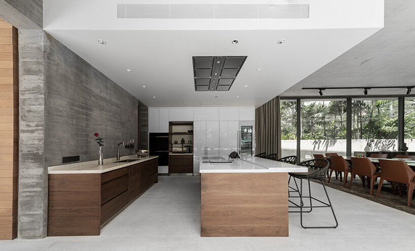 intersecting concrete slabs outline Stu/D/O architects' monolithic residence in thailand