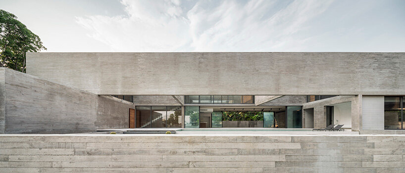 intersecting concrete slabs outline Stu/D/O architects' monolithic residence in thailand