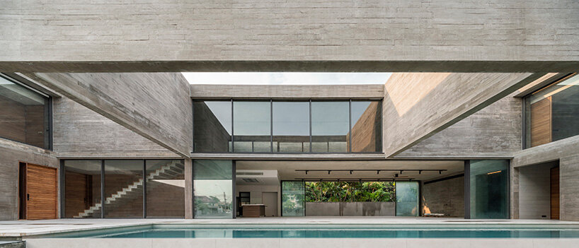 intersecting concrete slabs outline Stu/D/O architects' monolithic residence in thailand