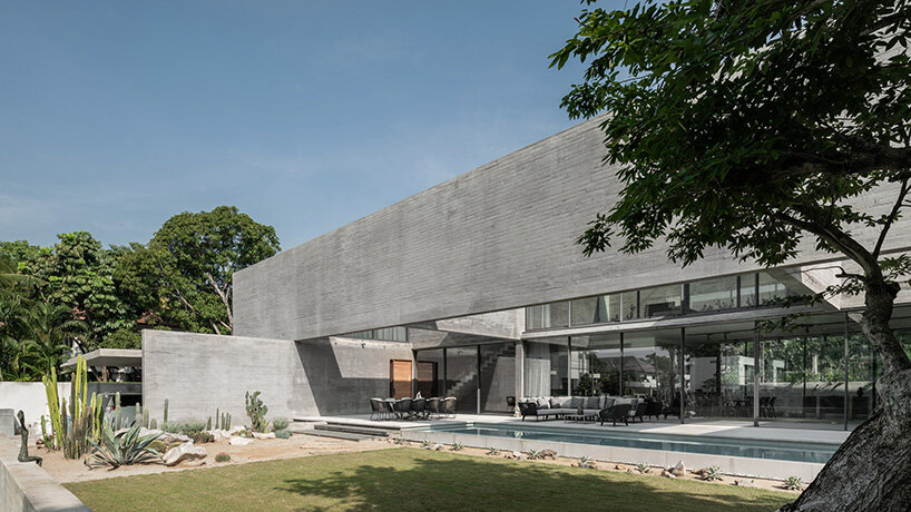 intersecting concrete slabs outline Stu/D/O architects' monolithic residence in thailand