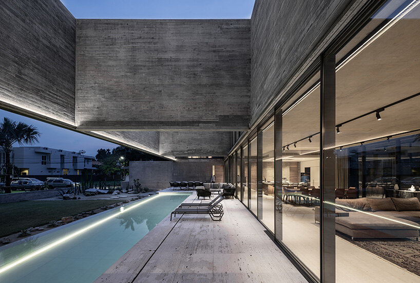 intersecting concrete slabs outline Stu/D/O architects' monolithic residence in thailand