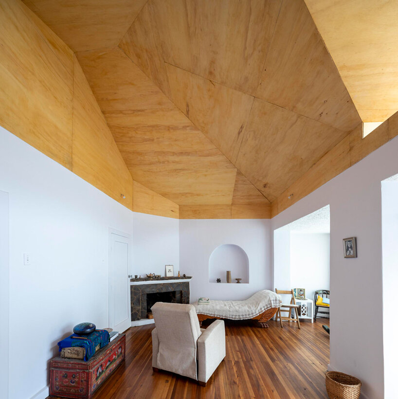 a rooftop observatory by studio 'la cabina de la curiosidad' links to the mountains of quito