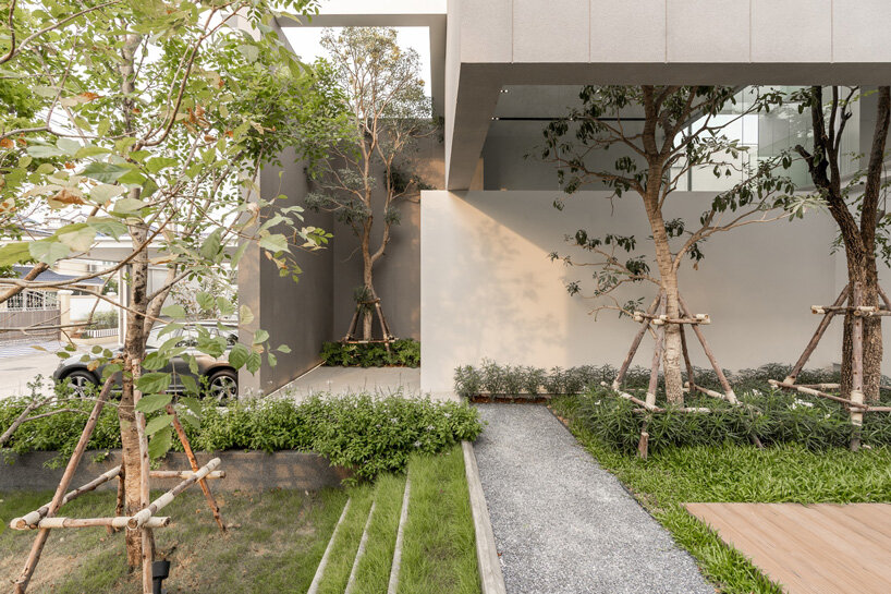 four miniature courtyards bring nature inside this secluded family home in thailand