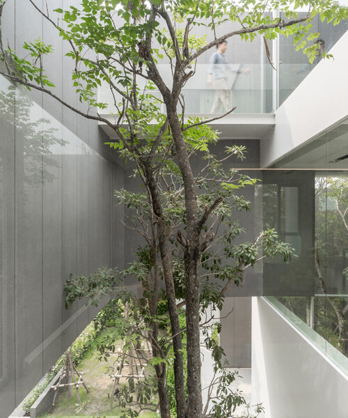 four miniature courtyards bring nature inside this secluded family house in thailand