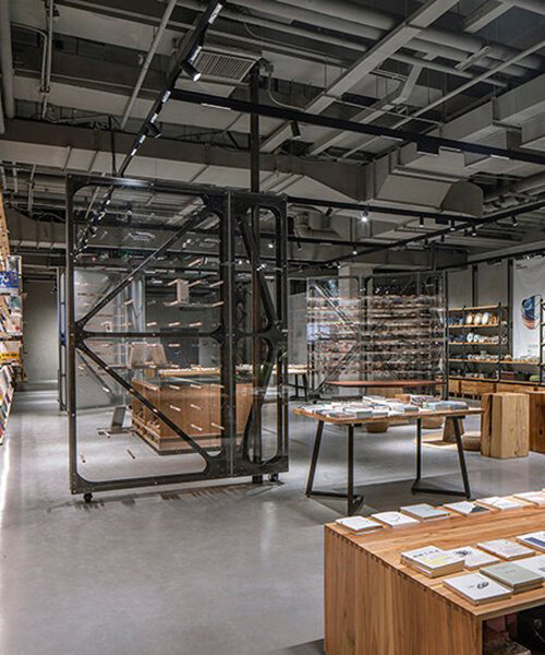 transparent rotating walls + exposed pipes assemble LUO studio's flexible bookstore space
