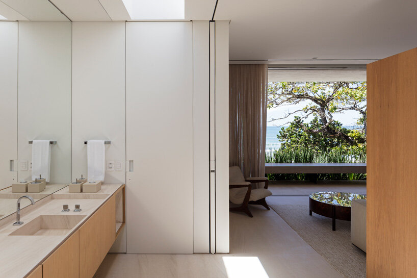 zenithal skylight illuminates minimalist JD house by studio arthur casas in brazil
