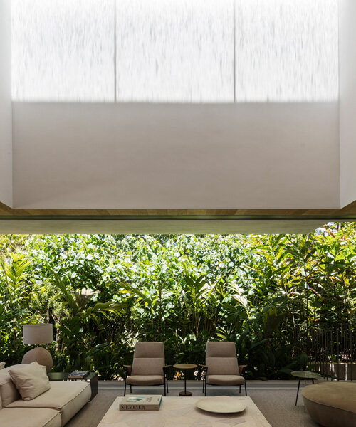 zenithal skylight illuminates minimalist JD house by studio arthur casas in brazil