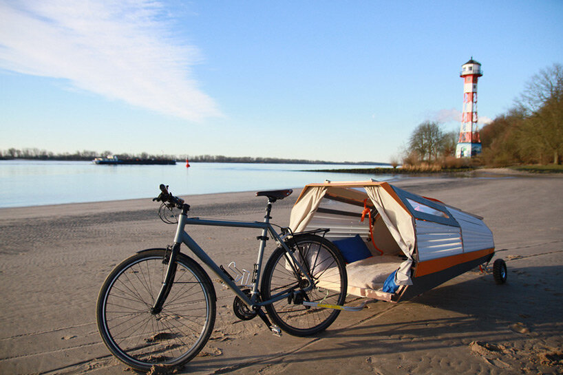 this portable treehouse trailer by henry k. wein can be towed on a bike to provide shelter anywhere