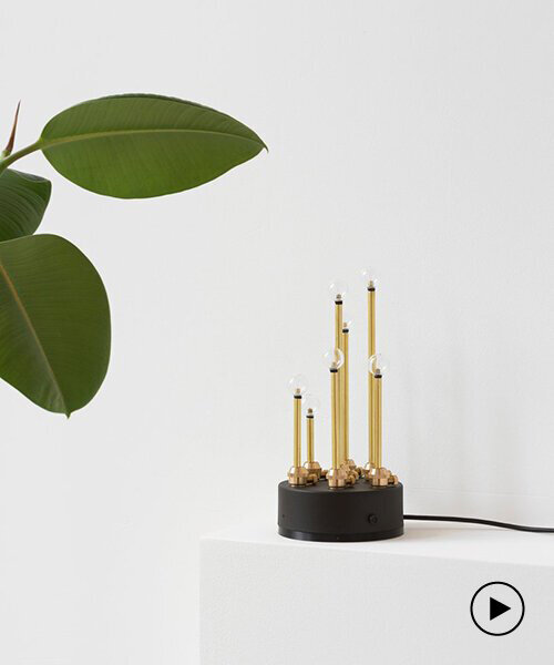 canari is a brass table lamp that creates light patterns when the air is polluted