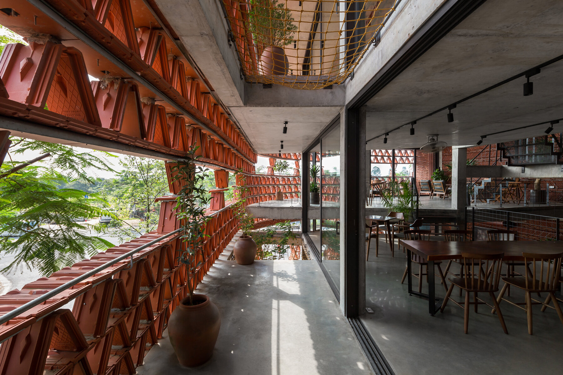 H&P architects wraps 20,000 tiles around 'ngói space' in vietnam