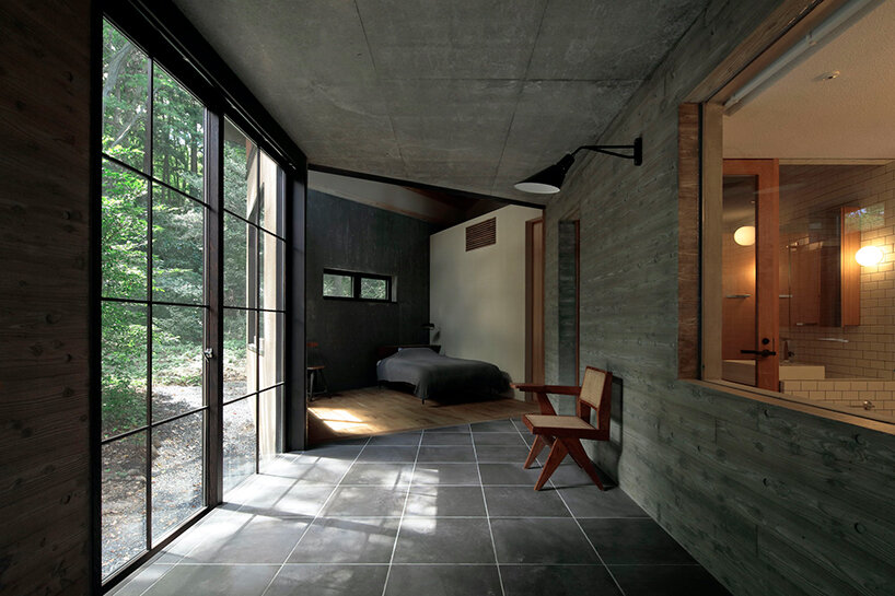 irregular-angled 'phase dance' residence by takeshi hirobe wraps around a large tree in japan