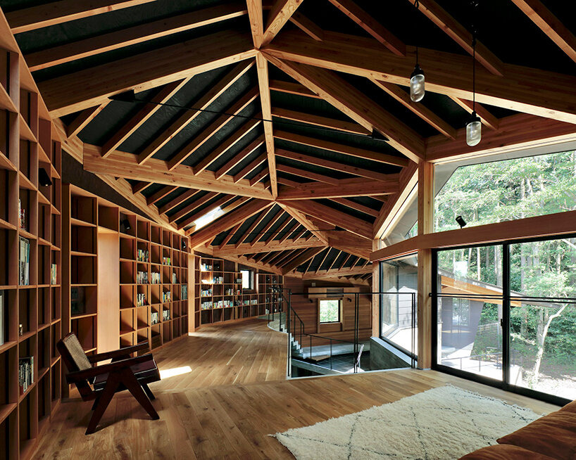 irregular-angled 'phase dance' residence by takeshi hirobe wraps around a large tree in japan