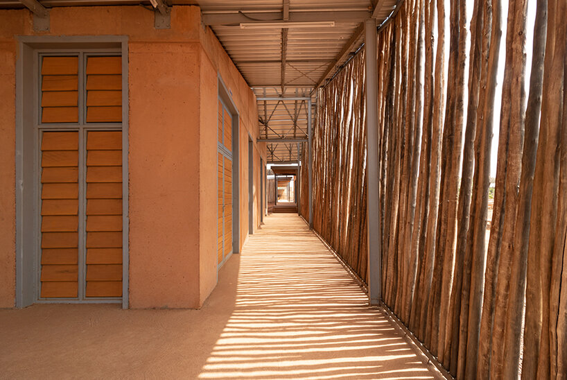 local clay + transparent timber skin assemble kéré architecture's university in west africa