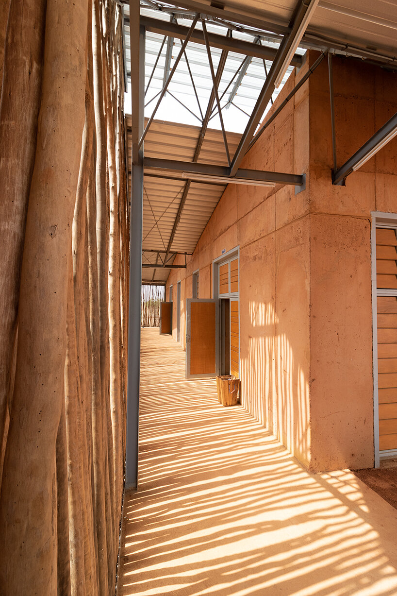 local clay + transparent timber skin assemble kéré architecture's university in west africa