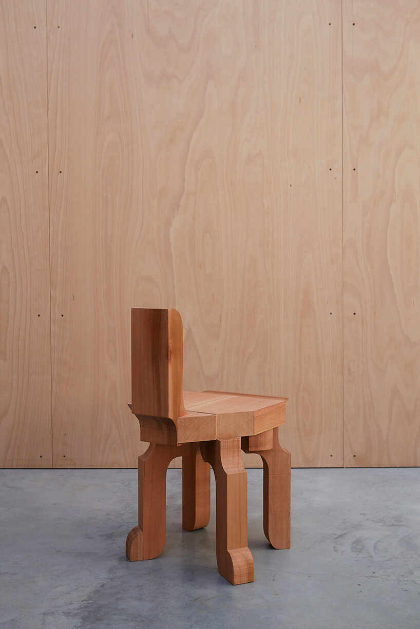 max lamb exhibits puzzle-like wooden furniture along chairs in stone at salon 94 design