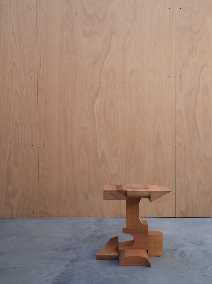max lamb exhibits puzzle-like wooden furniture along chairs in stone at salon 94 design