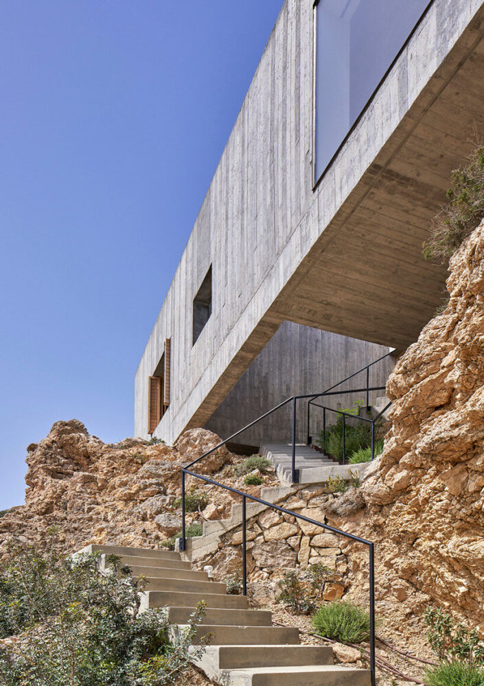 OOAK architects builds geometric concrete residence on jagged landscape ...