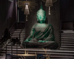 YOD group decorates new york restaurant interior with 4.5-meter-tall  glass-hewn buddha sculpture
