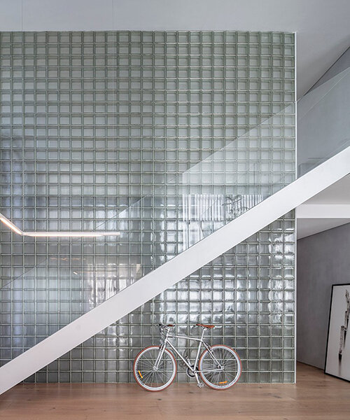glass block walls let light permeate a duplex apartment in tel aviv