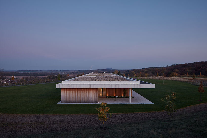 ADR architects' kostelec house takes shape as two stretching concrete slabs