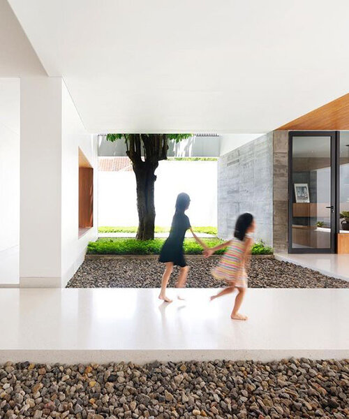 inward-facing family house in indonesia is arranged around a semi-open patio