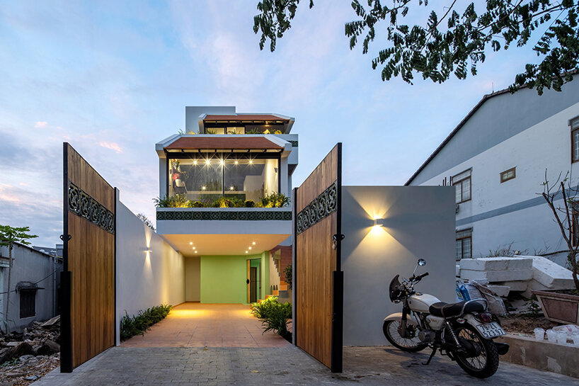 serpentine pink staircase highlights the inclination of AD+studio's house in vietnam