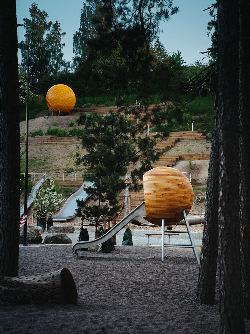 a stockholm park is dotted with these colorful playground spheres by andrénfogelström