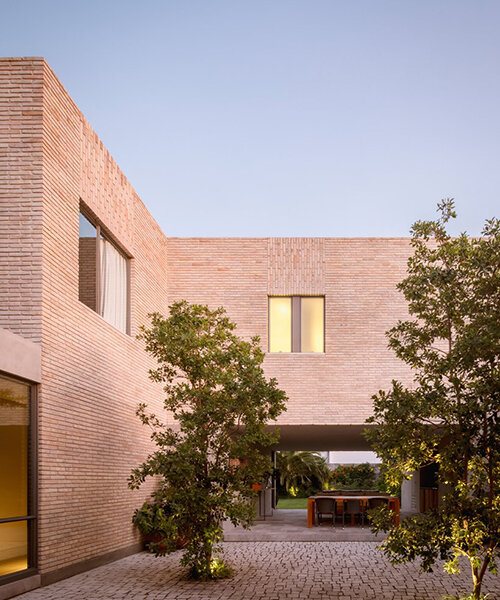 white clay brick residence revolves around interior courtyards in mexico city