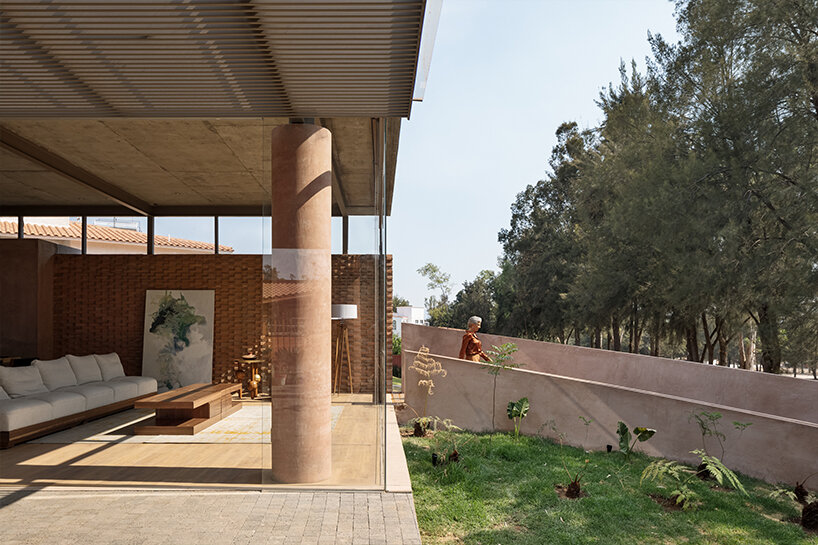 opposite circular openings offer visual connection through 'casa UC' in mexico