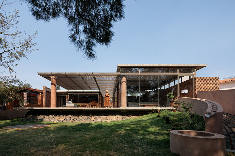 opposite circular openings offer visual connection through 'casa UC' in mexico