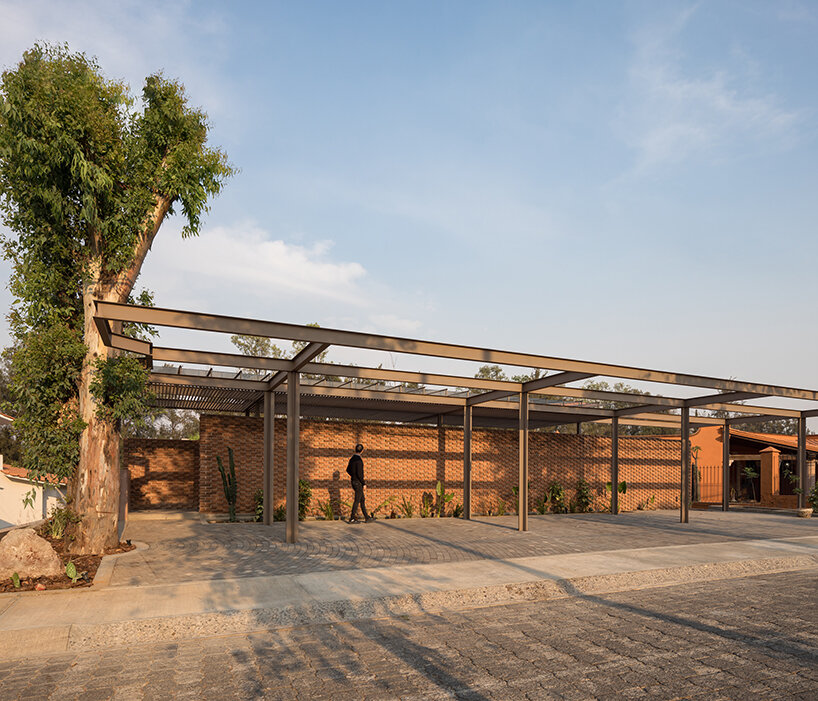 opposite circular openings offer visual connection through 'casa UC' in mexico
