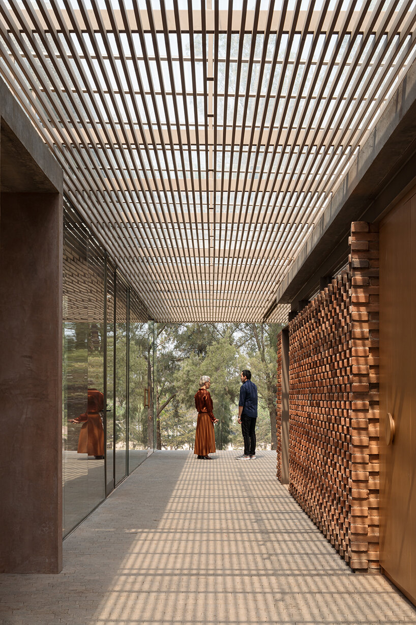 opposite circular openings offer visual connection through 'casa UC' in mexico