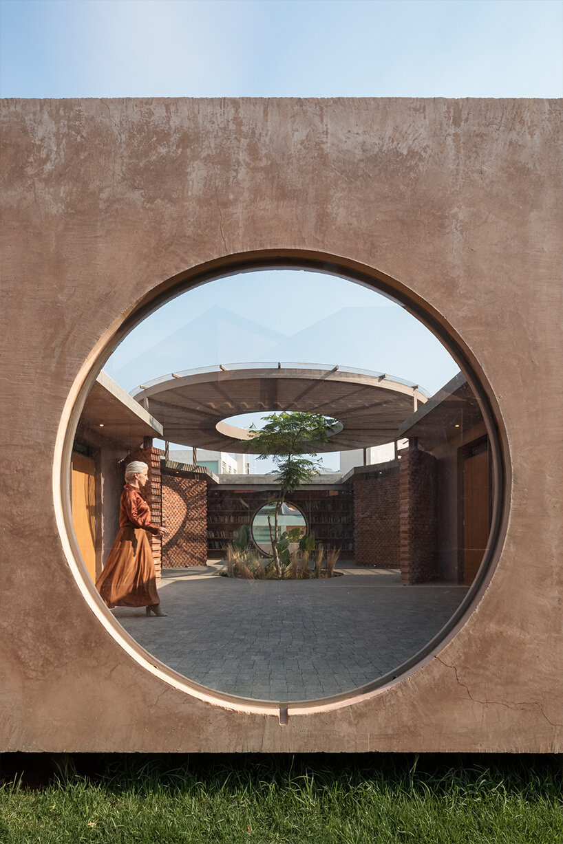 opposite circular openings offer visual connection through 'casa UC' in mexico